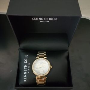 Kenneth Cole New York Gold wristwatch.